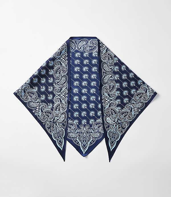 A dark blue bandana with a light blue paisley pattern is laid out flat against a plain white background.