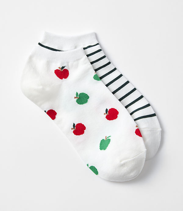 A pair of white ankle socks, one adorned with red apples and green pears, the other with black and white stripes, rests on a plain white background.