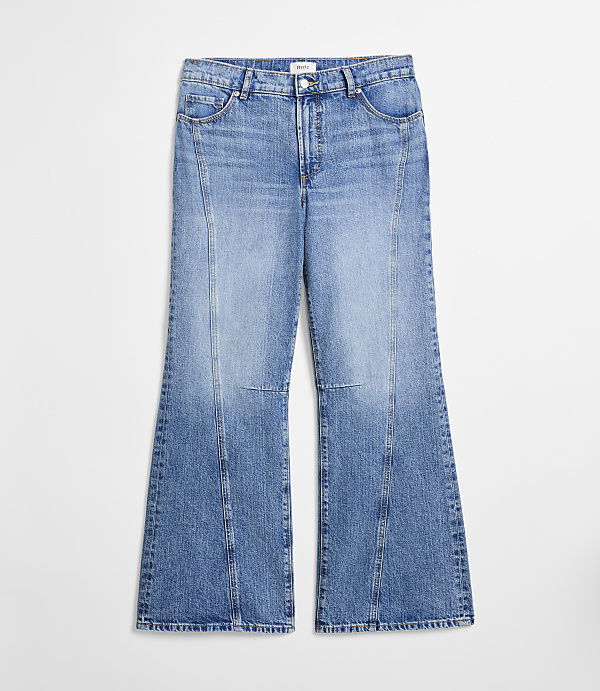 A pair of light blue flared jeans with vertical seams are displayed against a plain white background.