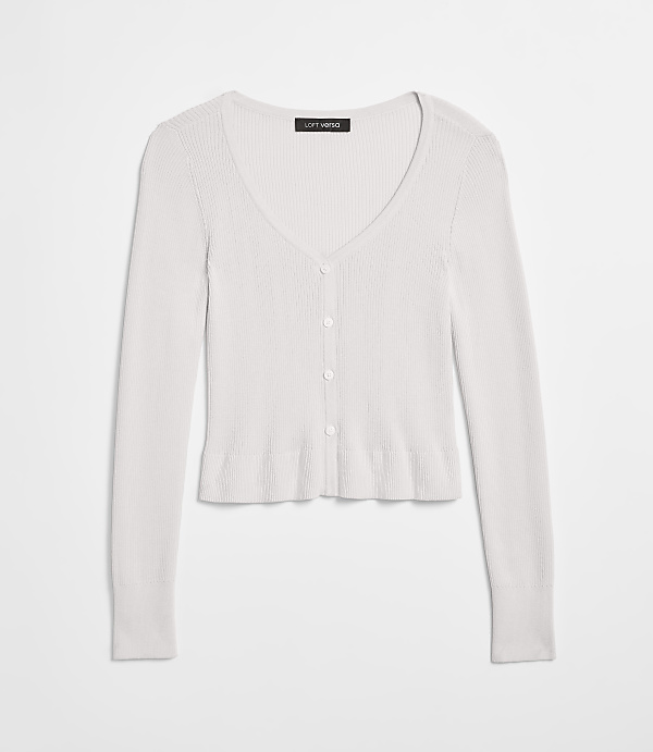 A white ribbed knit cardigan with a V-neck and button closure is laid flat against a plain white background.