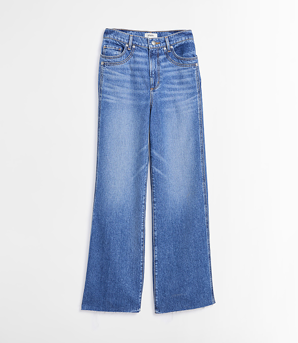 A pair of light blue wide-leg jeans with a high waist and distressed detailing are displayed against a plain white background.