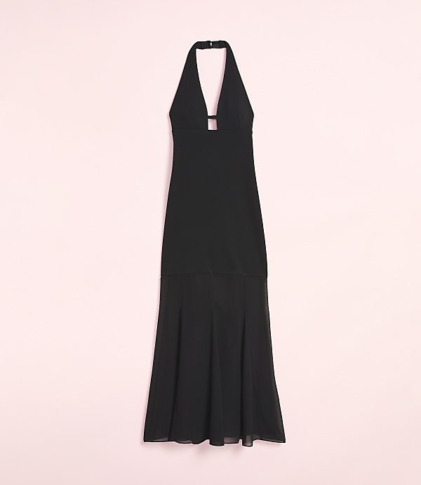 A black halterneck maxi dress with a flowing skirt is displayed against a soft pink background.