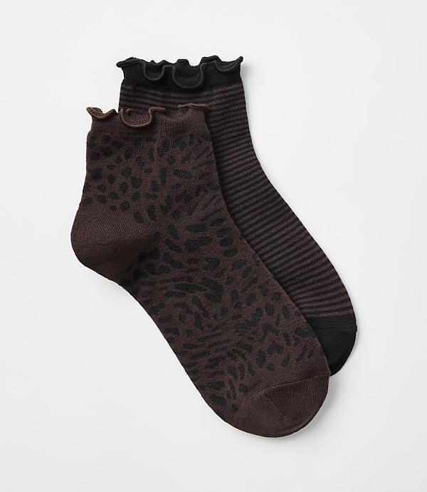 Two ankle socks, one with a brown leopard print and the other with black and brown stripes, are arranged on a plain white background.