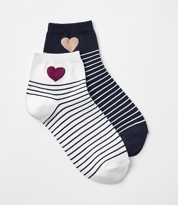 Two striped ankle socks, one white with a maroon heart and the other navy with a tan heart, rest against a plain white background.