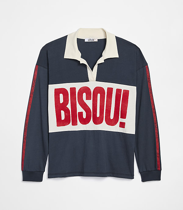 A navy blue long-sleeved rugby shirt with a cream collar and a cream chest panel featuring the red text "BISOU!" is displayed against a plain white background.