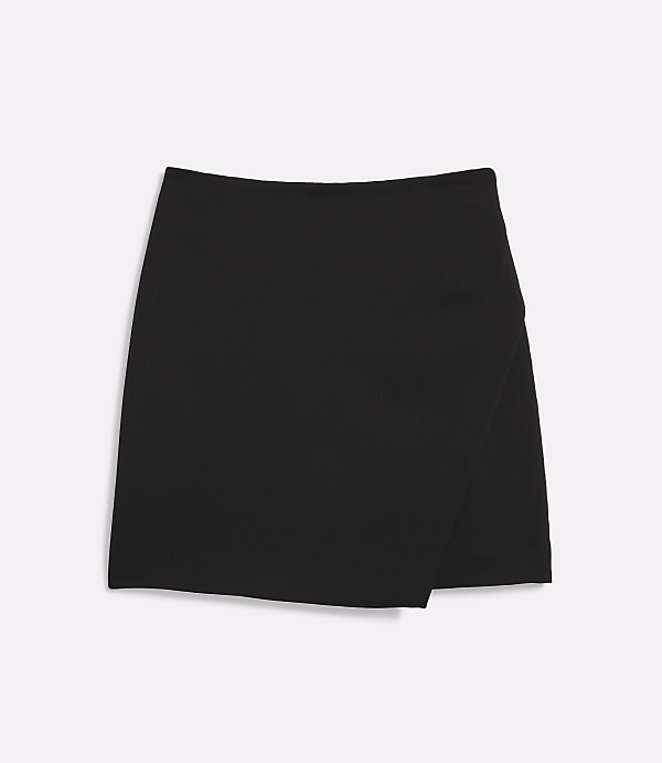 A black asymmetrical skirt lies flat against a white background.