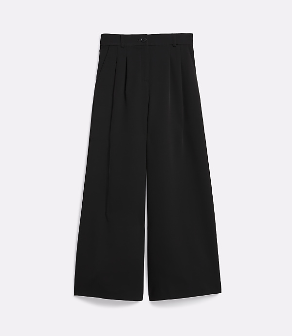 Black wide-leg trousers with pleats are laid flat against a plain white background.