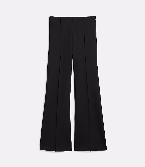 Black flared pants with vertical seams are laid flat against a plain white background.