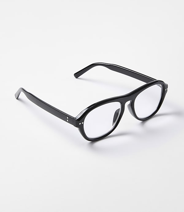 Black-rimmed glasses with clear lenses rest on a plain white surface.