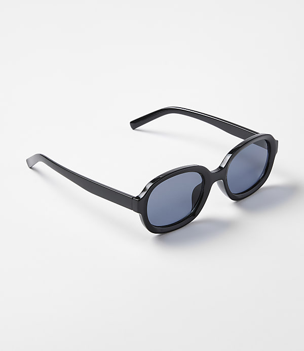 Black oval sunglasses rest on a plain white background.