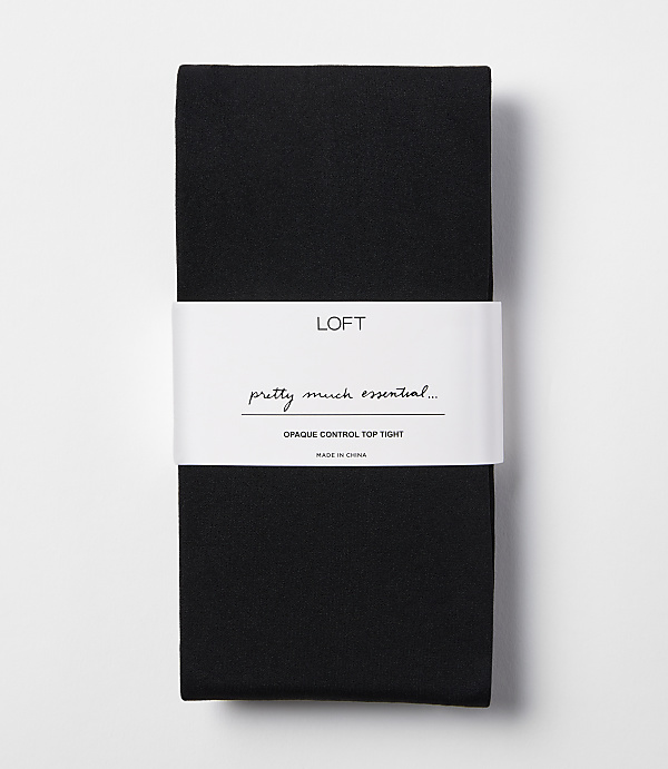 A pair of black opaque control top tights is neatly folded with a white band around the middle, set against a plain white background.