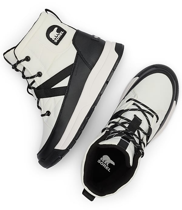 A pair of white and black Sorel boots with black laces are arranged on a white background.
