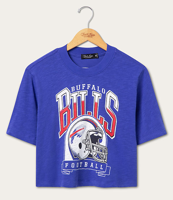 A royal blue cropped t-shirt with a vintage Buffalo Bills graphic hangs on a wooden hanger against a plain white background.