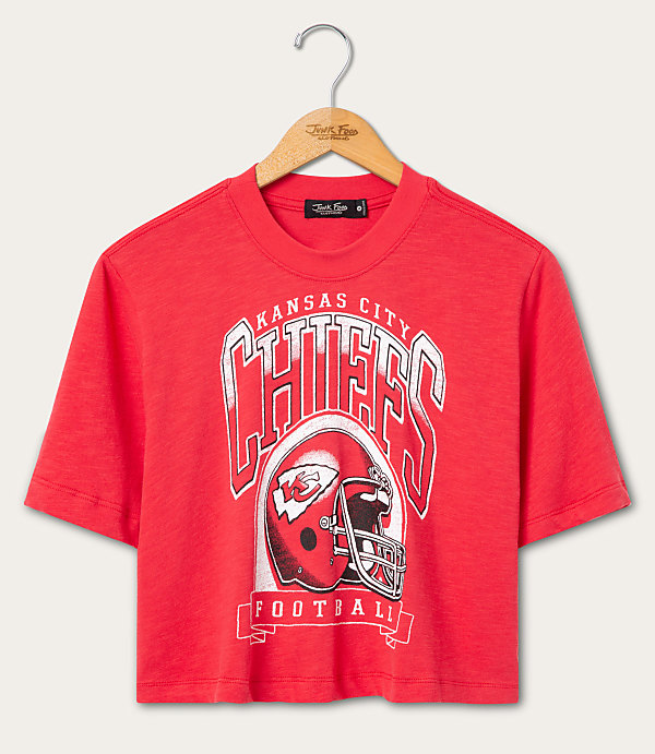 A red Kansas City Chiefs football t-shirt hangs on a wooden hanger against a plain white background.