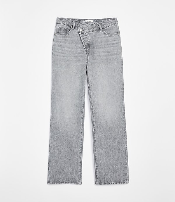 Light gray denim jeans with an asymmetrical waistband are displayed against a plain white background.