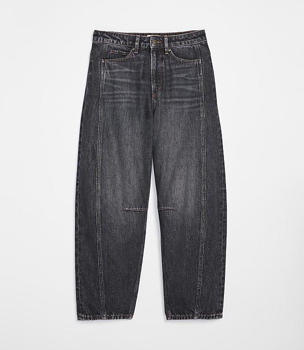 A pair of dark wash, wide-leg jeans with a distressed knee sits on a plain white background.
