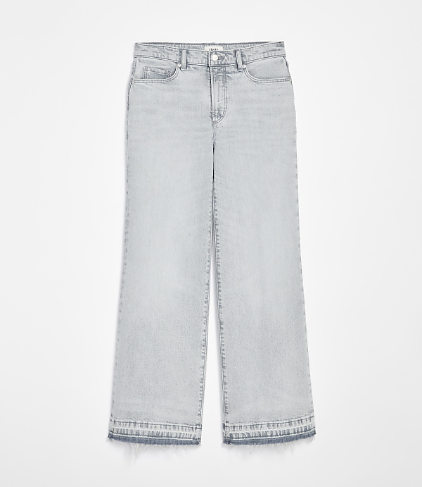 Light wash wide-leg jeans with a frayed hem are displayed against a plain white background.