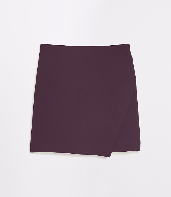A plum-colored wrap skirt lies flat against a white background.