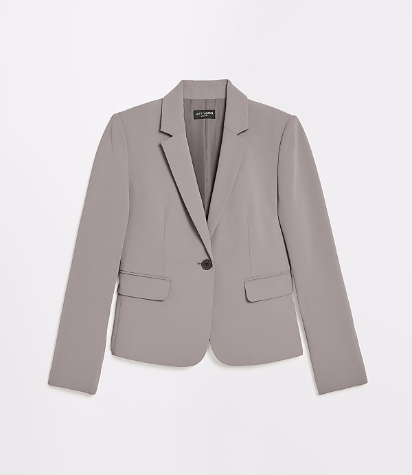 A light purple blazer with a single button closure is displayed against a plain white background.