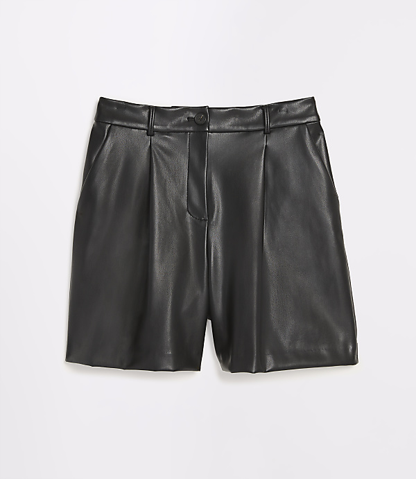 Black faux leather shorts with pleats in the foreground are set against a plain white background.