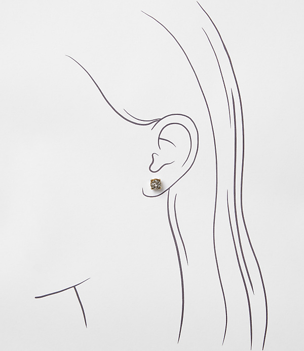A single, small, square-shaped earring with a textured surface is worn on a stylized ear, set against a plain white background.