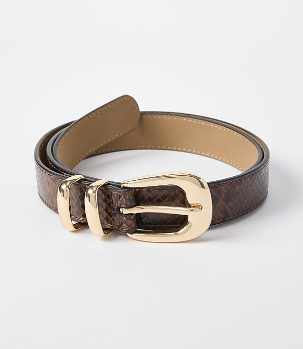 A brown snakeskin belt with a gold buckle lies on a white background.