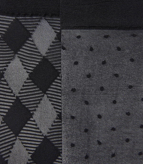 A close-up view reveals a split image with a diamond argyle pattern on the left and a polka dot pattern on the right, both against a dark background.