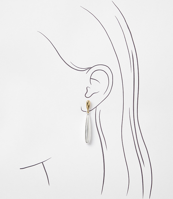 A delicate silver teardrop earring with a gold clasp hangs from a sketched ear against a plain white background.