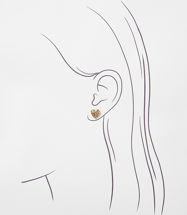 A delicate gold heart-shaped earring adorns a sketched ear, set against a plain white background.