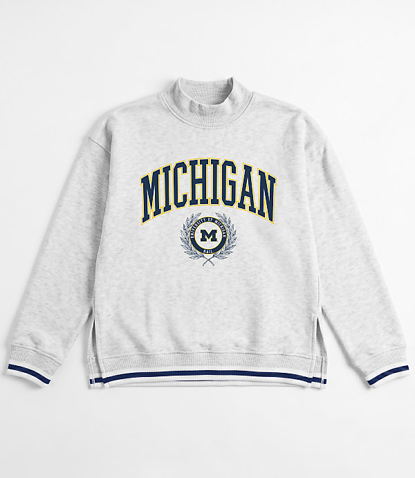 A light gray sweatshirt with "MICHIGAN" emblazoned across the chest in navy blue lettering and a white background.