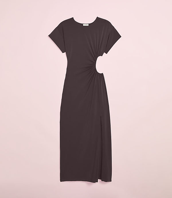 A dark brown, ruched midi dress with a side cutout and slit is displayed against a soft pink background.