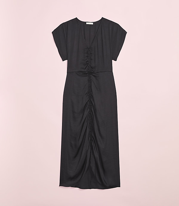 A black ruched midi dress is displayed against a soft pink background.