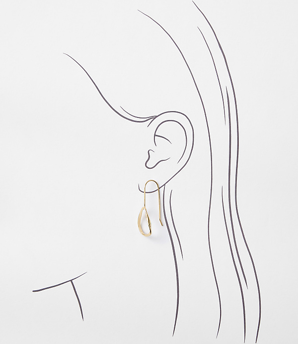 A delicate gold teardrop earring hangs from a sketched ear and hair against a plain white background.