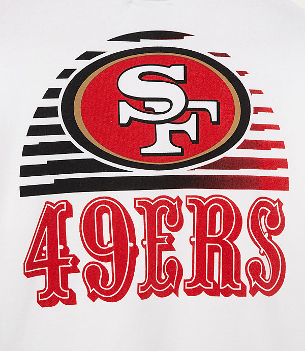 A white t-shirt features the San Francisco 49ers logo and team name in red and black, with a stylized striped background.