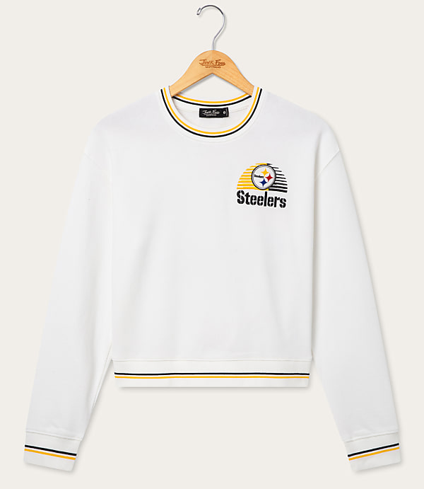 A white Pittsburgh Steelers sweatshirt with striped cuffs and neckline hangs on a wooden hanger against a plain white background.