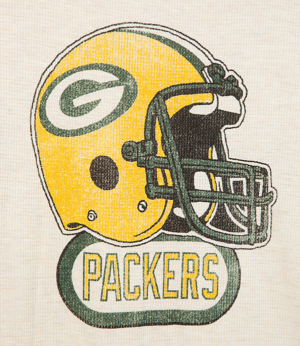 A vintage-style Green Bay Packers helmet and logo are printed on a cream-colored, textured fabric.