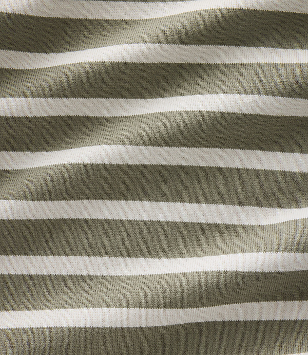 A close-up view of a fabric with horizontal stripes of olive green and white fills the frame, with the texture of the material visible throughout.