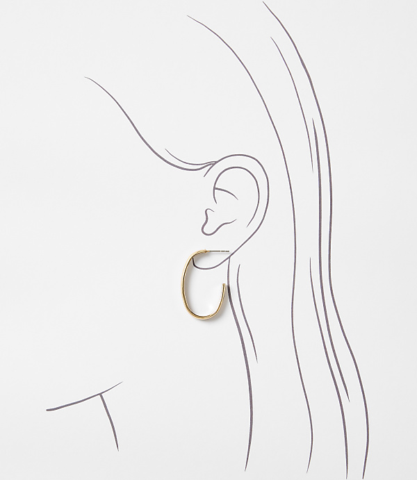 A simple gold oval hoop earring is worn on a sketched ear, with flowing lines suggesting hair in the background.