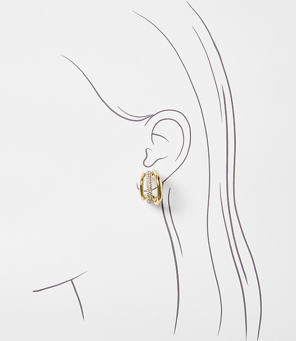 A gold and diamond earring adorns a stylized ear in the foreground, set against a minimalist line drawing of a head and neck in the background.