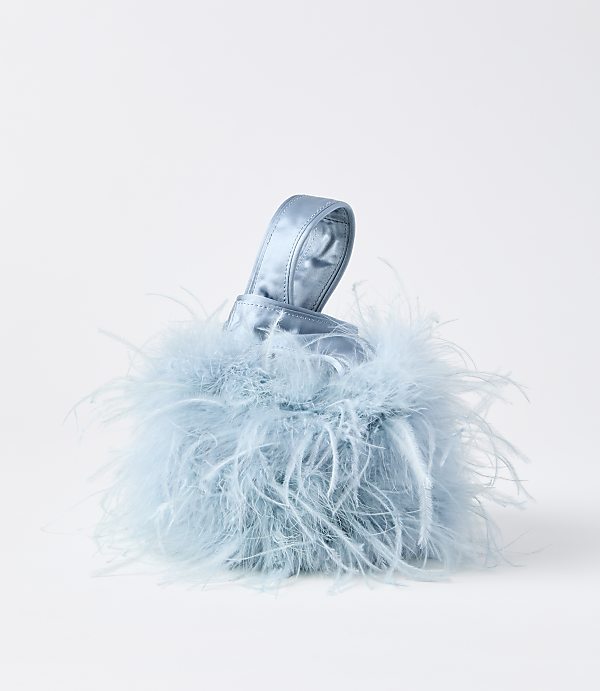 A fluffy, light blue, feather-covered handbag with a satin handle sits against a plain white background.