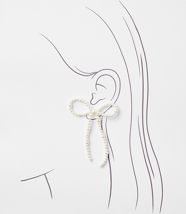 A pearl-encrusted bow earring dangles from a sketched ear against a white background.