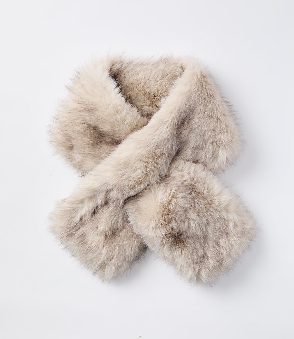 A fluffy, light brown faux fur scarf is laid out on a plain white background.