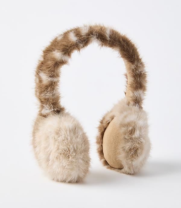 Fluffy brown and white earmuffs rest on a plain white background.