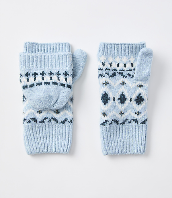 A pair of light blue convertible mittens with a fair isle pattern are laid out on a plain white background.