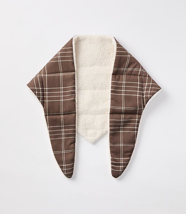 A brown plaid scarf with a cream sherpa lining is laid flat against a plain white background.