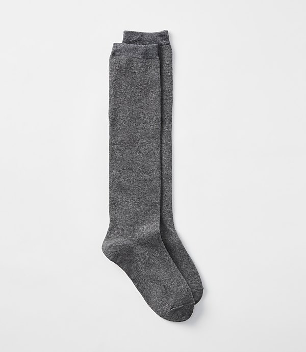 A pair of charcoal gray knee-high socks lies flat against a plain white background.