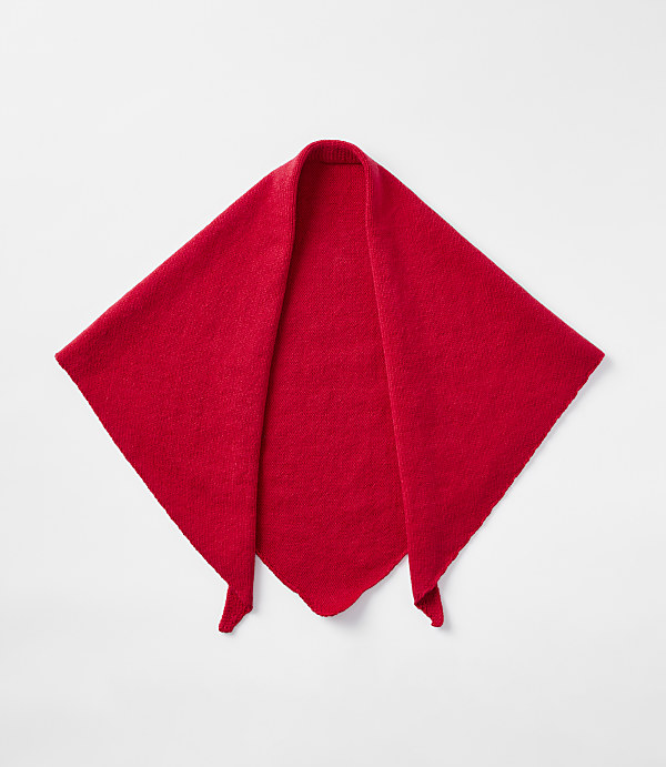 A bright red, diamond-shaped scarf with pointed ends lies flat against a plain white background.