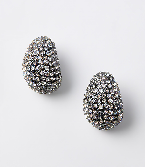 Two oval-shaped, crystal-encrusted earrings rest on a plain white background.