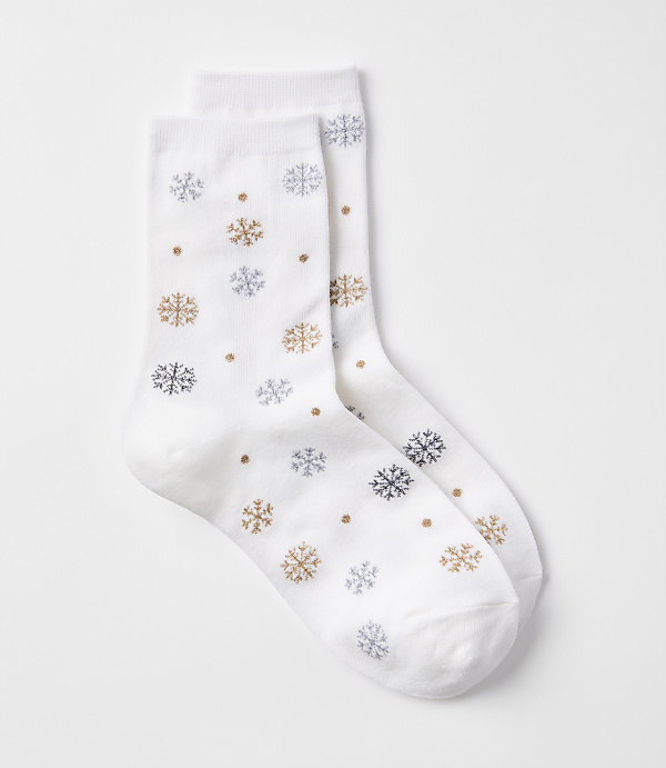 A pair of white socks with a snowflake pattern are laid out against a plain white background.