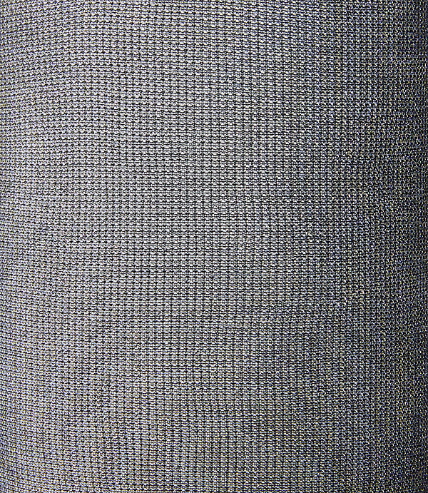 A close-up view of a gray textured fabric fills the frame, with subtle variations in light and shadow creating depth.